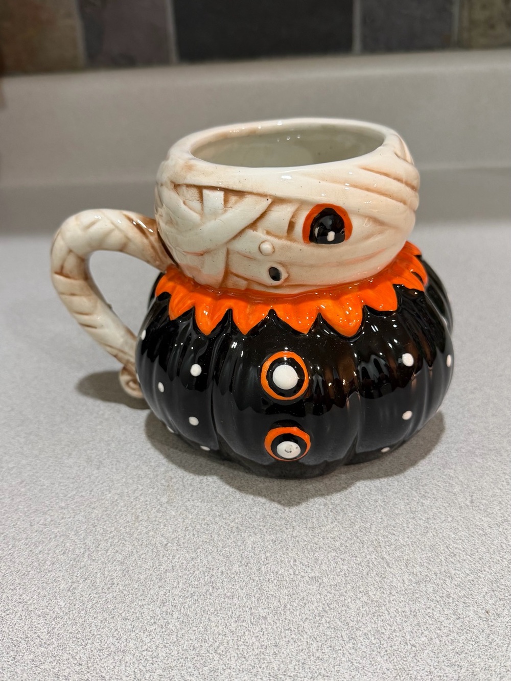 Johanna Parker New Ceramic Halloween Pumpkin Mummy Mug in Black, Orange, Cream